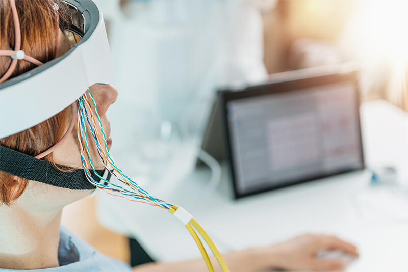 A person wearing a sensor cap during a brain-activity recording.